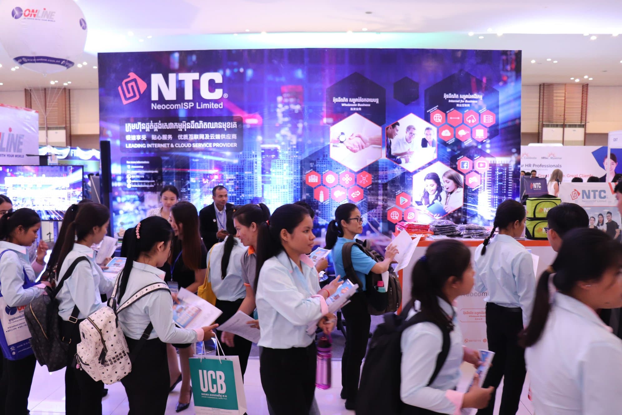 NeocomISP team photo with 'WE ARE ONE!' banner