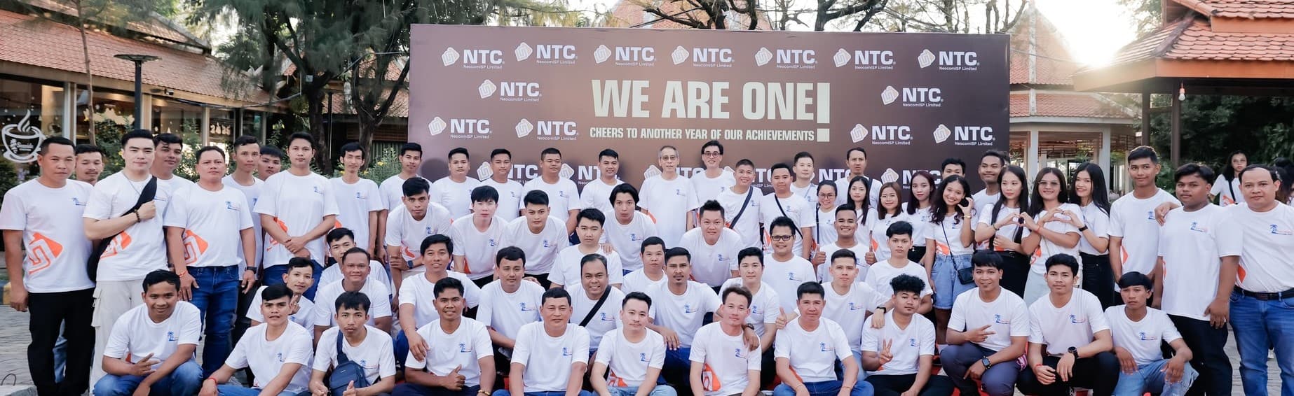 NeocomISP team photo with 'WE ARE ONE!' banner